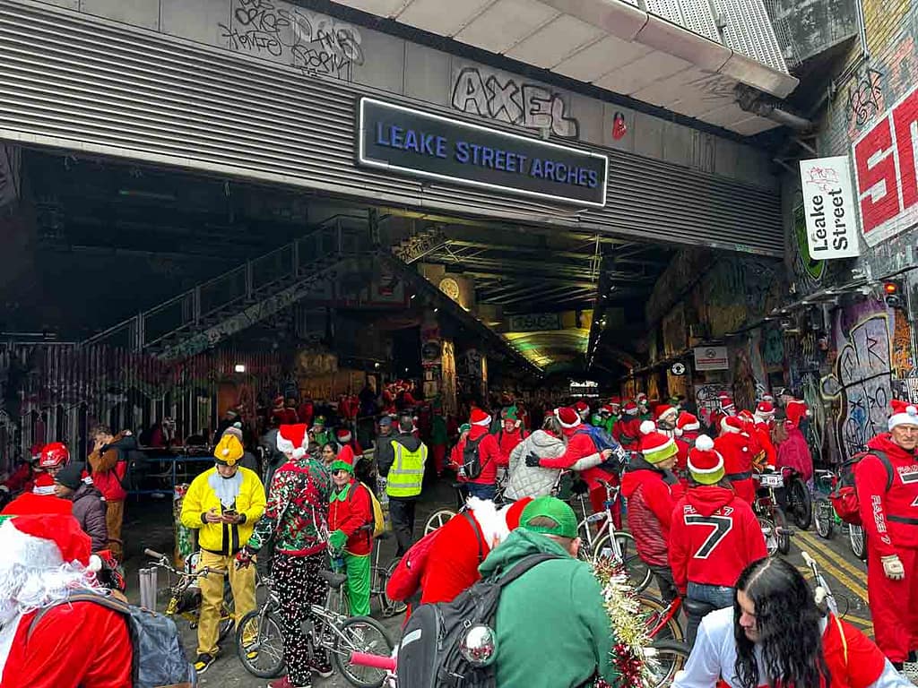 Entrance to Leak Street Arches with Santa Cruise participants waiting for the ride to begin