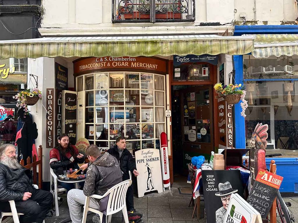 Customers sat outside The Tobacconist & Cigar Merchant playing board games