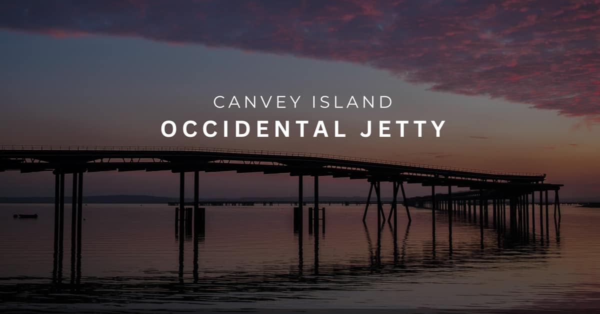 Silhouette of the Occidental Jetty at sunset, with the words Canvey Island, Occidental Jetty.