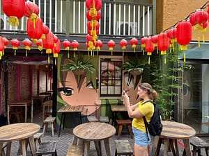 Maria taking photos in Spice Alley