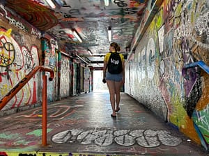 Maria walking through "Graffiti Tunnel" in Technology Lane